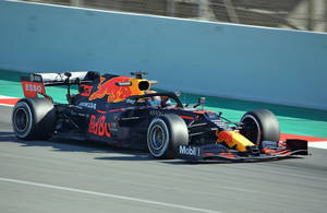 Alexander Albon In His High-speed Red Bull Racing Car Wallpaper