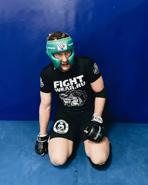 Alexander Volkov Kneeling Blue Wallpaper