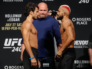 Alexandre Pantoja In Intense Face-off With Deiveson Figueiredo Wallpaper