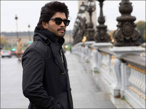 Allu Arjun Starring Down A Bridge In A Scene From Pushpa Wallpaper