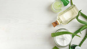 Aloe Vera Cream On White Table Wallpaper