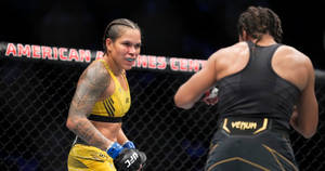 Amanda Nunes Looking At Julianna Peña Wallpaper