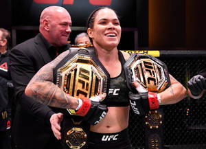 Amanda Nunes Two Championship Belts Wallpaper