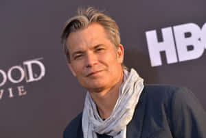 American Actor Timothy Olyphant Posing Confidently Wallpaper