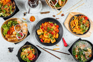 An Array Of Delicious Food Options On A Table Wallpaper