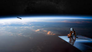 An Astronaut In Space Resting Wallpaper