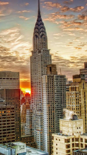 An Awe-inspiring Skyline Of Nyc Lights Glowing In The Nighttime Wallpaper