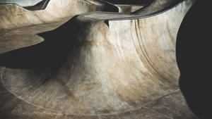 An Empty Skate Park Landscape With High Slope Wallpaper