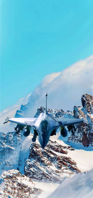 An Epic Shot Of A Fighter Jet Over Snow Capped Mountains As Wallpaper For Iphone Wallpaper