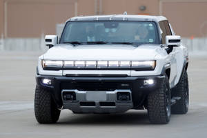 An Excellent Hummer Pickup Truck With White Headlights. Wallpaper