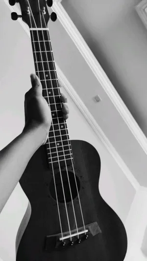 An Exquisite Close-up Of A Beautiful Acoustic Guitar With A Mesmerizing Pattern Wallpaper