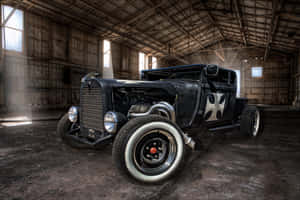 An Old Black Car In A Barn Wallpaper