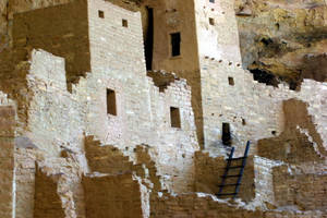 Ancient Mesa Verde Ruins Beneath A Brilliant Sky Wallpaper