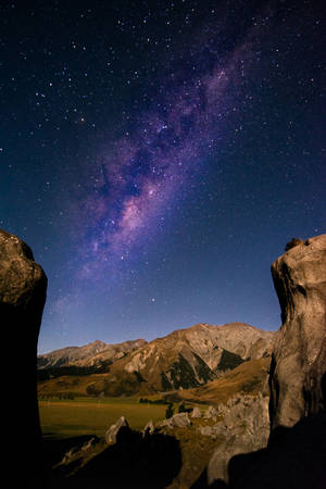 Andromeda Galaxy On Mountain Land Wallpaper