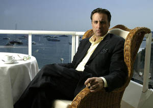 Andy Garcia Intensely Cherishing A Cuban Cigar Wallpaper