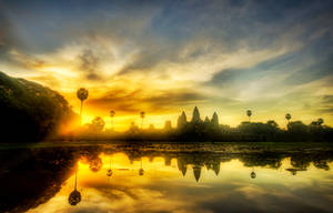 Angkor Wat Beneath A Beautiful Sunset Sky Wallpaper