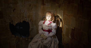 Annabelle Doll In Dark Room Wallpaper