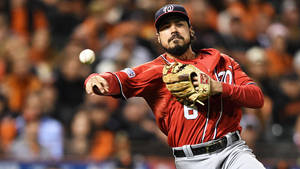 Anthony Rendon Throwing Ball In Red Uniform Wallpaper