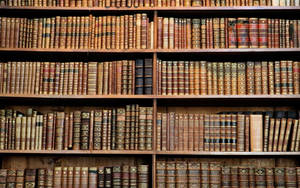 Antique Books On A Wooden Rack Wallpaper