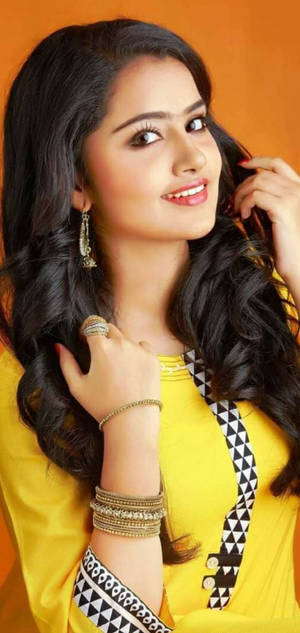 Anupama Parameswaran Orange Background Wallpaper