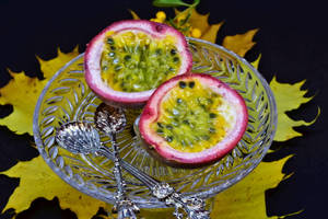 Appetizing Ripe Passion Fruit On Plate Wallpaper