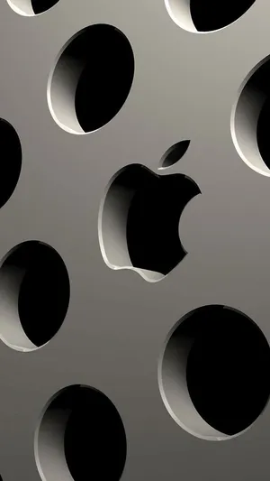 Apple Logo On A Metal Surface With Holes Wallpaper