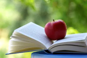 Apple On A Book Wallpaper