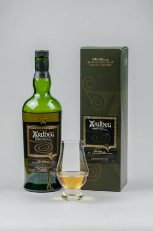 Ardbeg Corryvreckan Whisky Bottle With Shot Glass Wallpaper