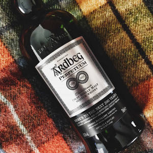 Ardbeg Perpetuum Whisky Bottle On Picnic Scarf Wallpaper