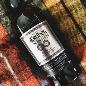 Ardbeg Perpetuum Whisky Bottle On Picnic Scarf Wallpaper