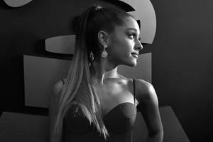 Ariana Grande Glancing At The Camera Wallpaper