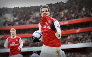 Arsenal Fc Players With The Ball Wallpaper