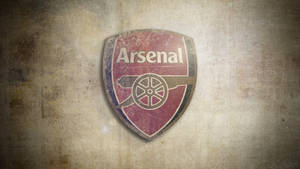 Arsenal Logo In Grunge Brown Wallpaper