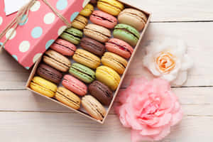 Artistic Multicolored Macaron In A Gift Box Wallpaper