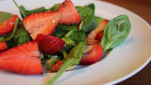 Arugula And Strawberries Plate Wallpaper