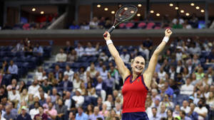 Aryna Sabalenka Raising Her Arms Triumphantly Wallpaper