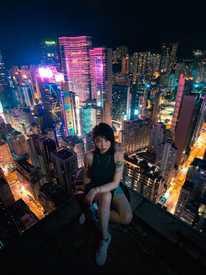 Asian Woman In Scenic Cityscape Wallpaper