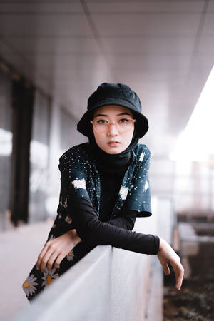 Asian Woman In Stylish Bucket Hat Wallpaper