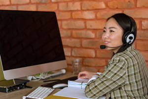 Asian Woman On A Computer Wallpaper