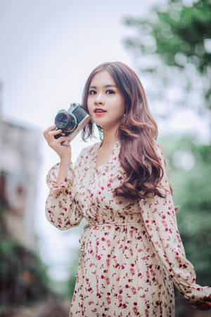 Asian Woman With A Professional Camera Wallpaper