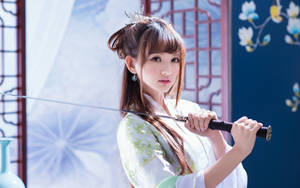 Asian Women Holding A Sword Wallpaper