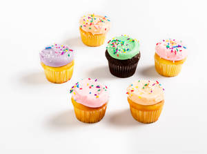 Assorted Colorful Cupcakes Wallpaper
