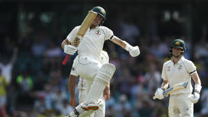 Australia Cricket Players Jumping In Joy Wallpaper
