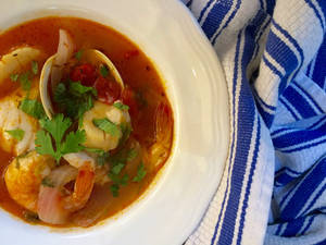 Authentic French Bouillabaisse On Striped Tablecloth Wallpaper