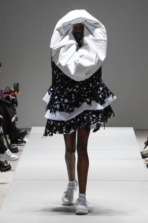 Avant-garde Fashion With Comme Des Garçons Wallpaper