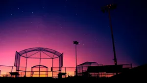 Awesome Softball Arena At Dusk Wallpaper