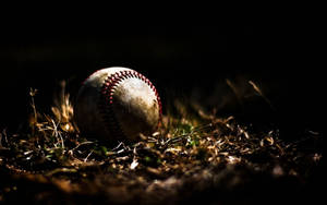 Awesome Softball On The Ground Wallpaper