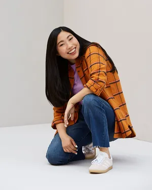 Awkwafina Orange Checkered Polo Wallpaper