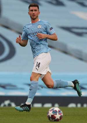 Aymeric Laporte Running With Starry Football Wallpaper