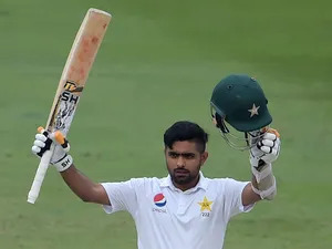 Babar Azam Celebrating With His Cricket Bat Wallpaper